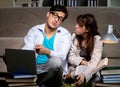 Two students studying late preparing for exams Royalty Free Stock Photo