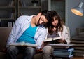 Two students studying late preparing for exams Royalty Free Stock Photo