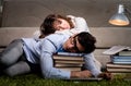 Two students studying late preparing for exams Royalty Free Stock Photo
