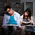 Two students studying late preparing for exams Royalty Free Stock Photo