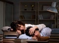 Two students studying late preparing for exams Royalty Free Stock Photo