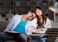 Two students studying late preparing for exams Royalty Free Stock Photo