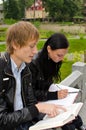 Two students studying outdoors Royalty Free Stock Photo
