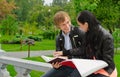 Two students studying outdoors Royalty Free Stock Photo