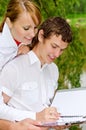 Two students studying outdoors Royalty Free Stock Photo