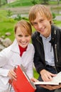 Two students studying outdoors Royalty Free Stock Photo