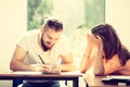 Two students talking in classroom