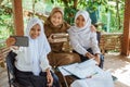 two students and the teacher in veil selfie together Royalty Free Stock Photo