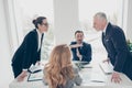 Two stylish business persons in suits having disagreement, war, Royalty Free Stock Photo