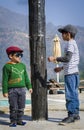 Two stylish kids wearing caps having fun together