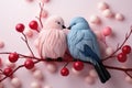 Two stylized birds, one pink and one blue, perched on a branch.