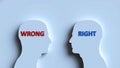 Two stylized human head profiles facing each other, one with red \'WRONG\' text, the other Royalty Free Stock Photo
