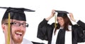 Two successful student in graduation gowns Royalty Free Stock Photo