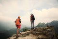 women hikers enjoy the view on the top of great wall