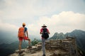 women hikers enjoy the view on the top of great wall