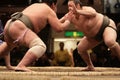 Two sumo wrestlers engaging in a fight Royalty Free Stock Photo