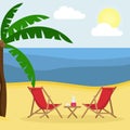 Two sunbeds with sun umbrella on the sandy beach with palm trees