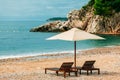 Two sunbeds and umbrella at luxury beach resort Royalty Free Stock Photo