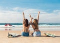 Two surfer girls at the beach Royalty Free Stock Photo