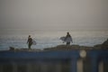 Two Surfers Walking At Sunset, Santa Cruz, California Royalty Free Stock Photo