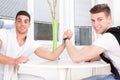 Two surprised men arm wrestling Royalty Free Stock Photo