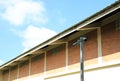 Two surveillance cameras near warehouse with brick wall Royalty Free Stock Photo