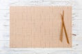 Two sushi chopsticks with empty brown bamboo mat or wood plate on white wooden Background Top view with copy space. empty asian Royalty Free Stock Photo