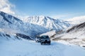 Two suv riding in snowy mountains Royalty Free Stock Photo