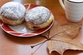Two sweet homemade donuts whit jam at wooden table Royalty Free Stock Photo