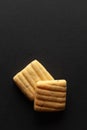 Two sweet and salted Cumin Cookies, on a black background. Royalty Free Stock Photo