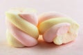 Two sweets marshmallow close-up on a pink background horizontal