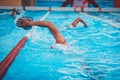 Two swimmers are practising swimming in the pool Royalty Free Stock Photo