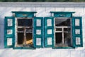 Two symmetric blue windows of ukrainian house