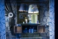 Two table lamps, curtains with holder, chest of drawers. Window dressing in blue tones of the Liberty store on Regent Street