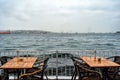 Two tables at an outdoor cafe on the seafront Royalty Free Stock Photo