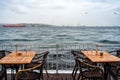 Two tables at an outdoor cafe on the seafront Royalty Free Stock Photo