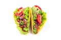 Two taco shells isolated on white, with lettuce, ground beef meat, mashed avocado, tomato, red onion and jalapeno pepper