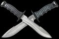 Two Tactical Combat Hunting Survival Bowie Knives With Crossed Blades Isolated On Black Background