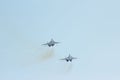 Two tactical jet fighter MIG-29 make maneuvers Royalty Free Stock Photo