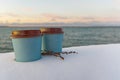 Two take away coffee with sea background at winter time. winter snow take away coffee cup sunset at sea Royalty Free Stock Photo