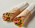 Two takeaway tortilla wraps with beef entrecote Royalty Free Stock Photo