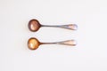 Two Tarnished Silver Spoons