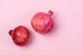 Two Tasty Fresh Ripe Pomegranate are Lying Pink Background Horizontal Close Up