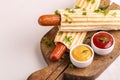 Two tasty grilled french hot dog with mustard and ketchup Royalty Free Stock Photo