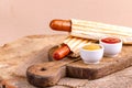 Two tasty grilled french hot dog with mustard and ketchup Royalty Free Stock Photo