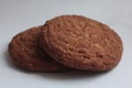 Two tasty  oatmeal cookies on white background Royalty Free Stock Photo