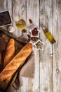 Two tasty traditional french baguettes made from wheat flour. Homemade fresh bread on a wooden tray Royalty Free Stock Photo