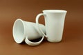 Two tea cups on brown background Royalty Free Stock Photo