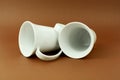 Two tea cups laying on brown background Royalty Free Stock Photo