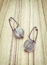 Two tea strainers on the wooden background Royalty Free Stock Photo